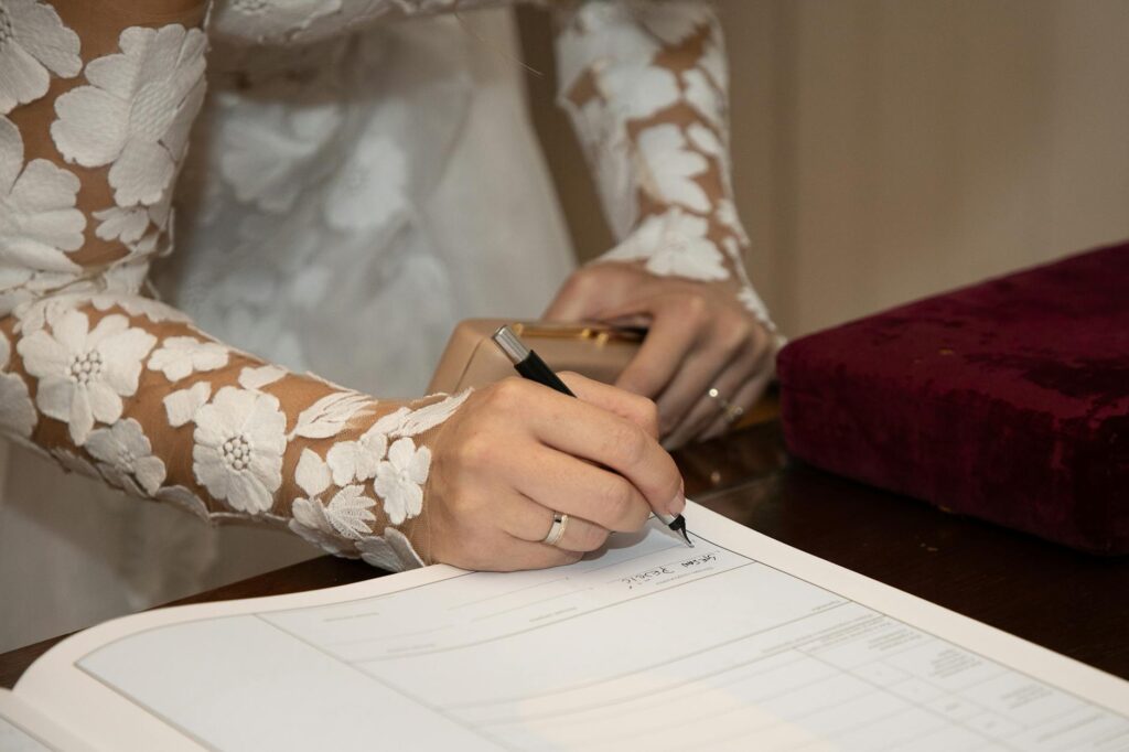 A checklist being filled out by a bride, highlighting important wedding details. — questions for wedding concierge