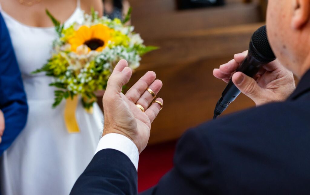 A close-up of a wedding officiant holding a ceremony script — wedding officiant Las Vegas