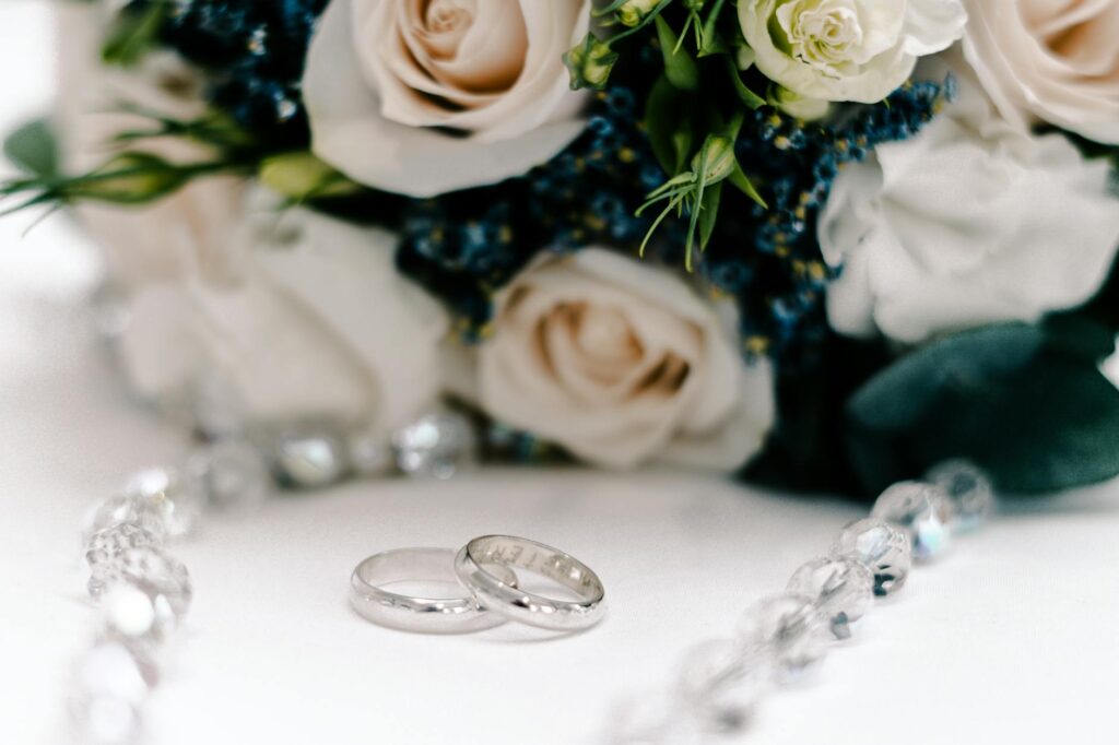 A close-up of a wedding ring and bouquet, symbolizing love and commitment. — Las Vegas elopement packages