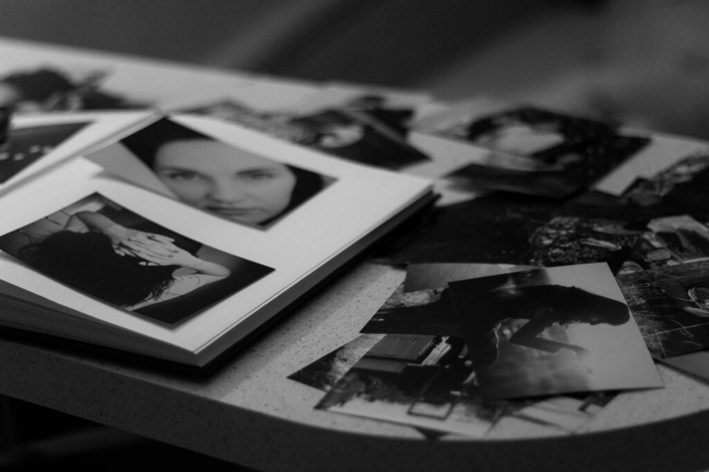 A close-up of wedding photo albums and prints. — Las Vegas wedding photographer