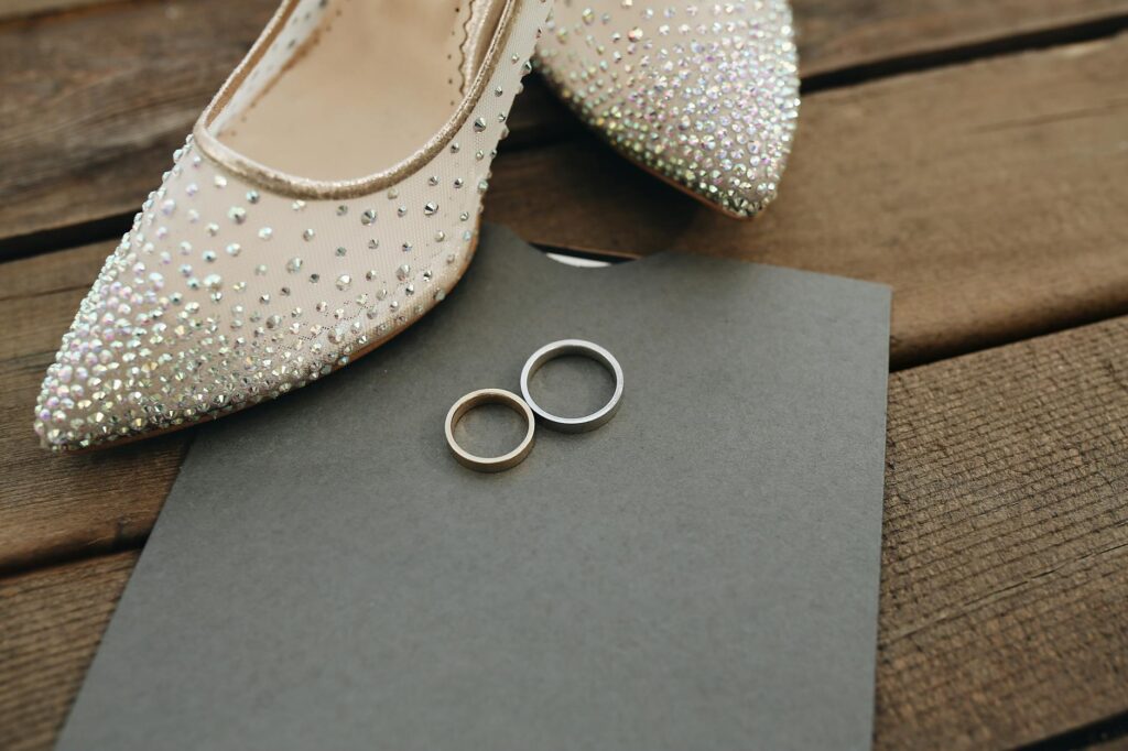 A close-up of wedding rings placed on a Las Vegas themed wedding invitation. — Las Vegas destination wedding planning