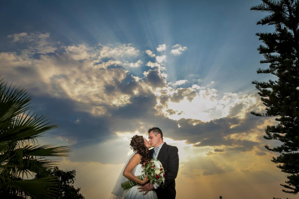 A couple enjoying their wedding ceremony with a stunning backdrop — affordable Las Vegas wedding tips