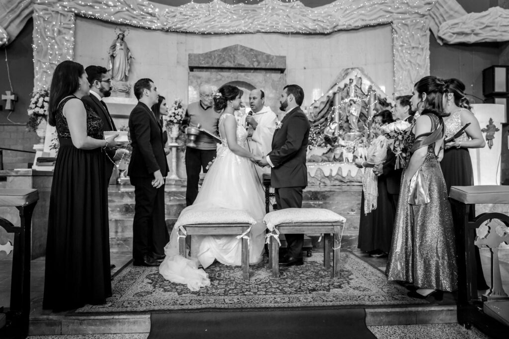 A couple exchanging vows at a famous Las Vegas chapel surrounded by friends and family. — Las Vegas destination wedding …