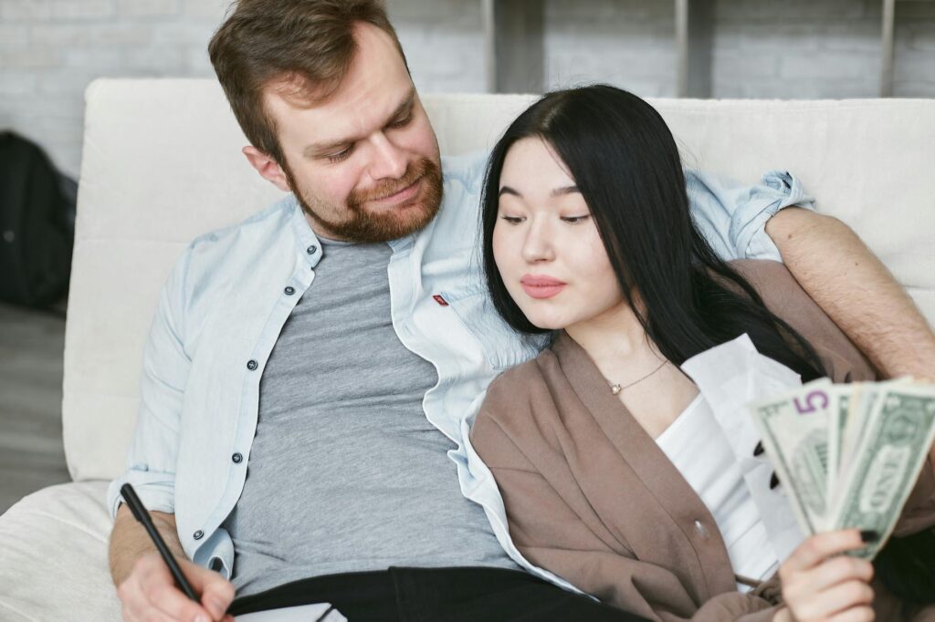 A couple happily planning their Las Vegas wedding budget together