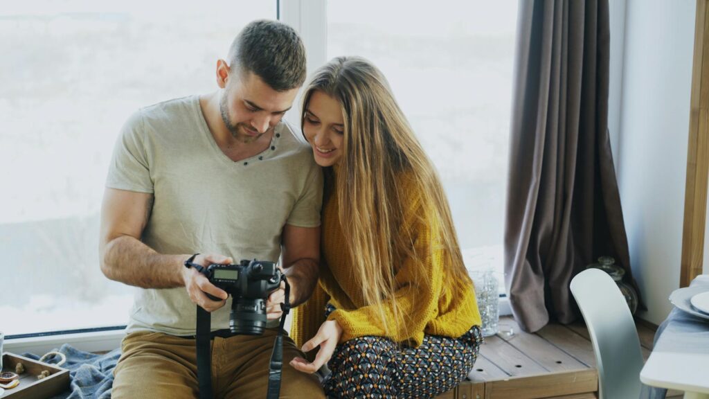 A couple reviewing photographer portfolios together. — Las Vegas wedding photographer