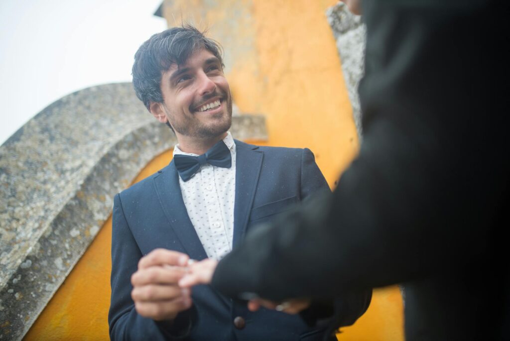 A couple smiling as they exchange rings during their ceremony — Las Vegas wedding officiant