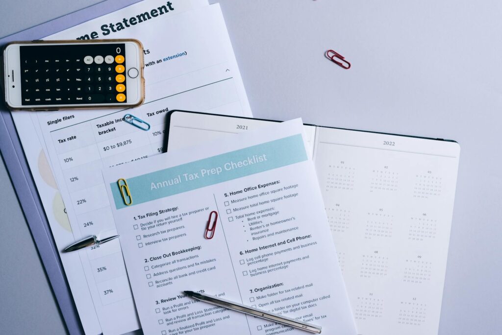 A detailed checklist of wedding budget categories on a desk. — affordable wedding vendors Las Vegas