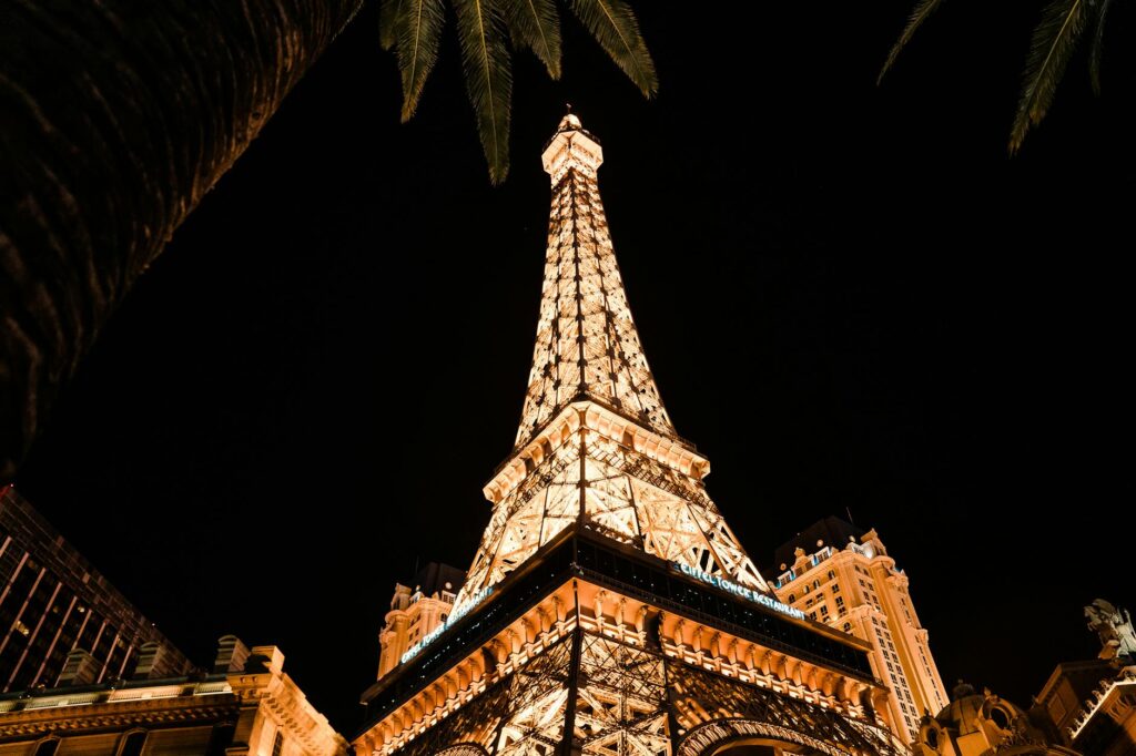 A festive wedding reception at Paris Las Vegas, with the Eiffel Tower replica illuminating the night sky. — Las Vegas we…