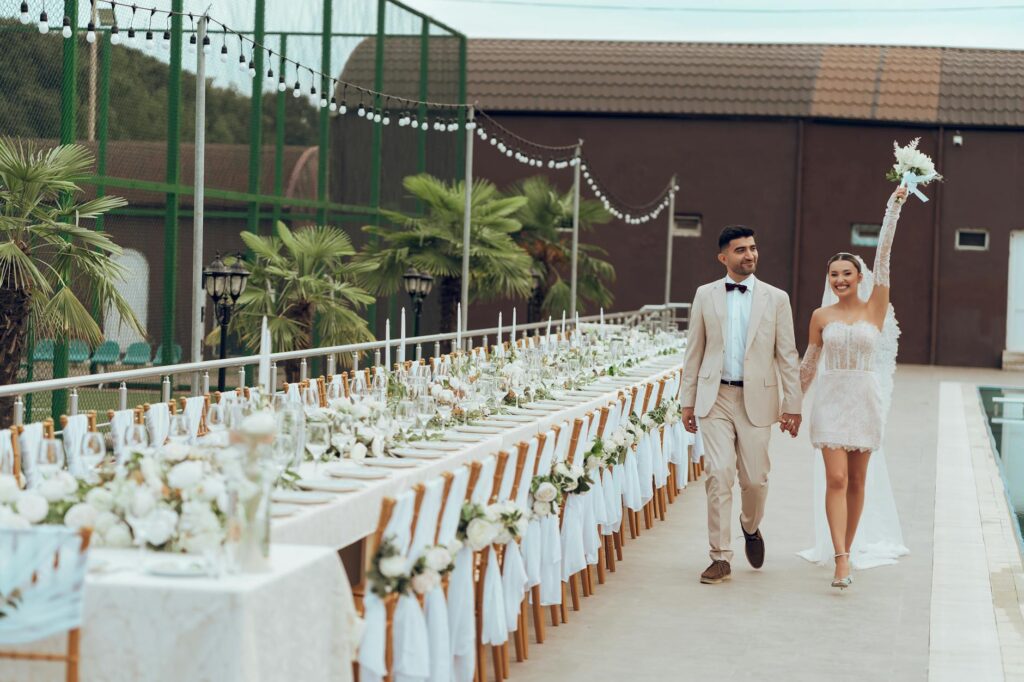 A happy couple at their wedding with beautiful but affordable decorations. — affordable wedding vendors Las Vegas