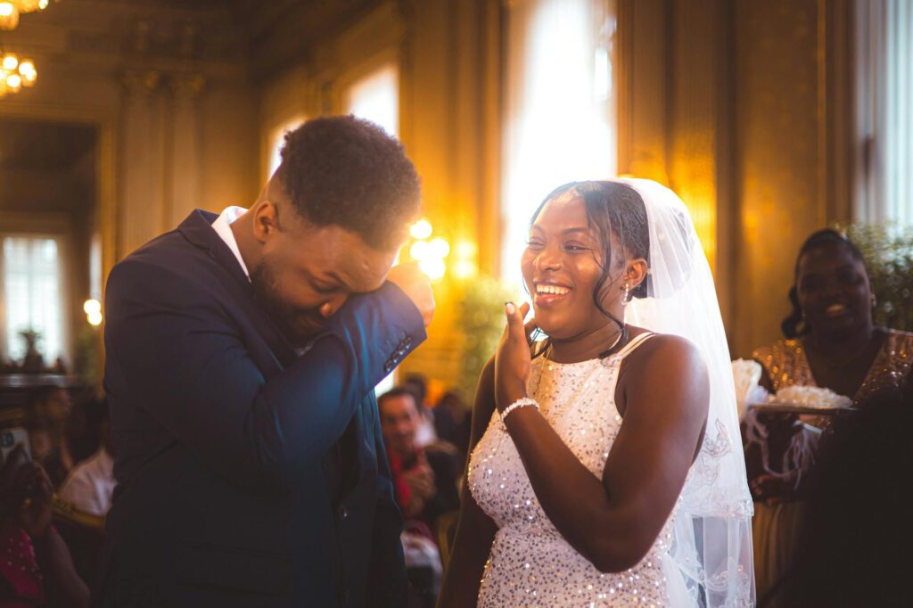 A happy couple celebrating their wedding day with friends and family in a luxurious venue. — Las Vegas wedding planning …