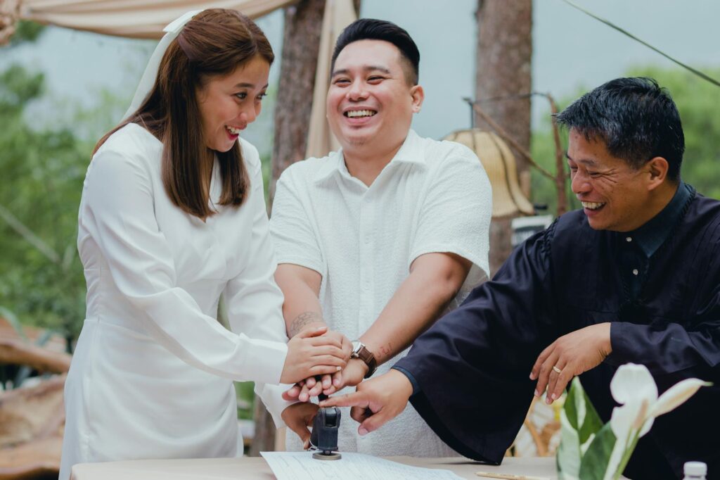 A happy couple discussing wedding plans with their chosen vendors. — affordable wedding vendors Las Vegas