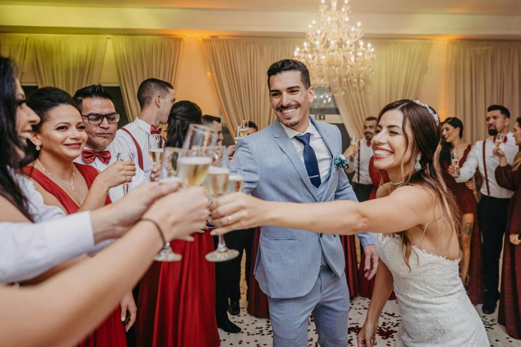 A joyful couple celebrating with friends at a cost-effective wedding reception. — budget Las Vegas wedding planning