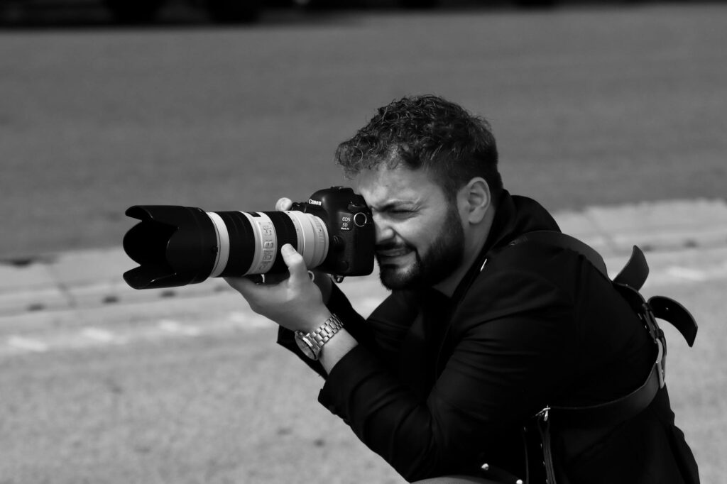 A photographer in action, capturing candid moments at a Las Vegas wedding. — Las Vegas wedding photographers
