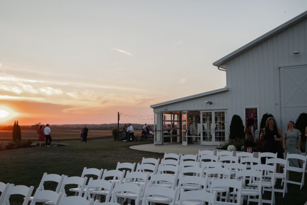 A summer wedding ceremony taking place at sunset with guests enjoying the evening warmth. — best time for Las Vegas wedding