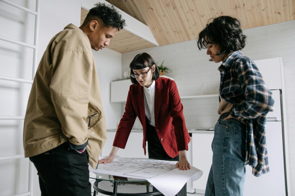 A wedding concierge discussing plans with a couple. — wedding concierge benefits