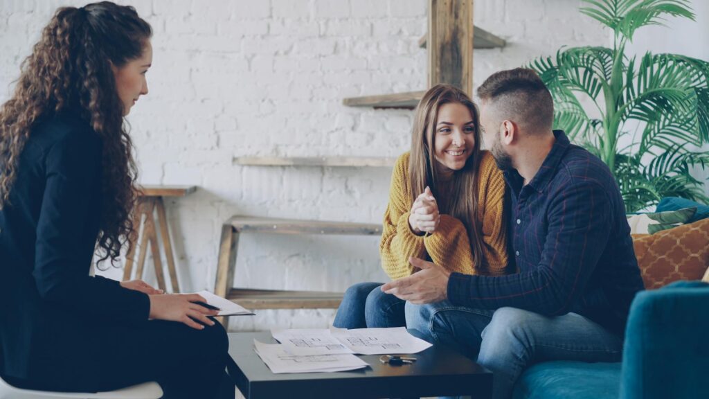 A wedding concierge meeting with a couple to discuss their plans — choose wedding concierge Las Vegas