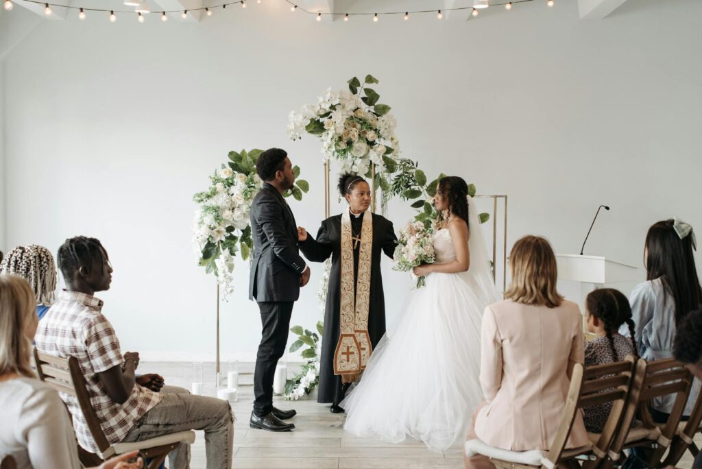A wedding officiant engaging with guests during a ceremony in a scenic Las Vegas location. — Las Vegas wedding officiants