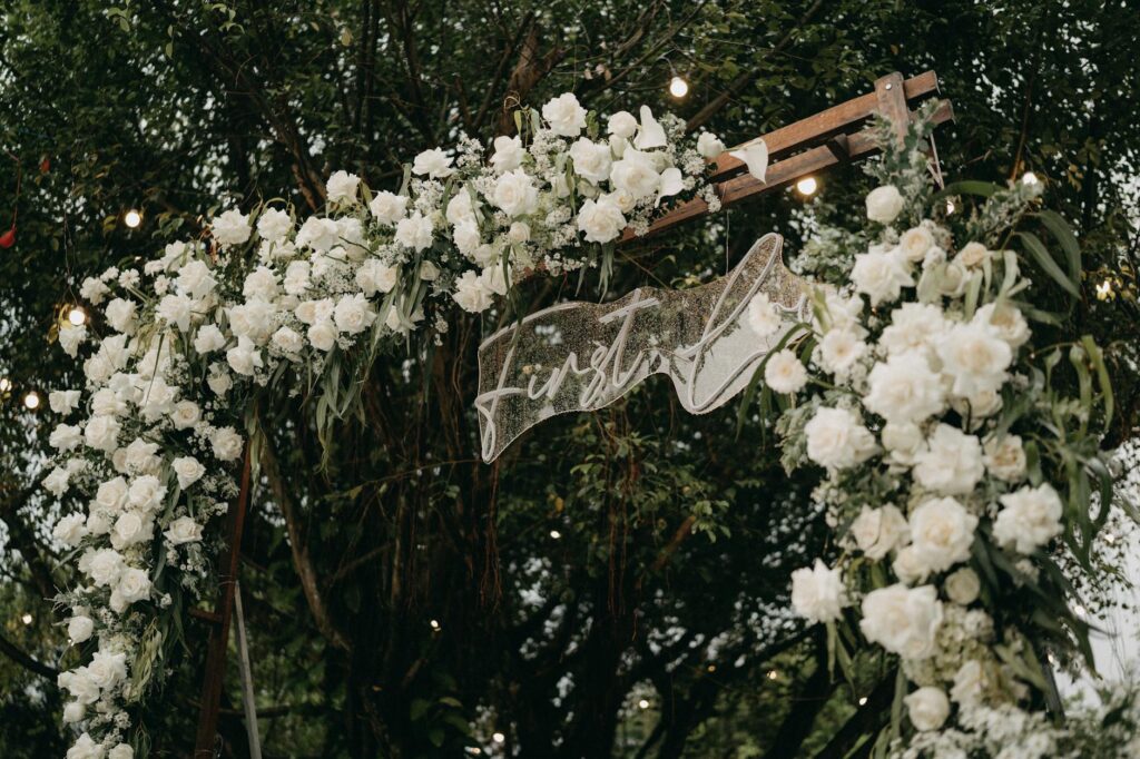 An enchanting garden wedding setup outdoors in Las Vegas, adorned with fairy lights and lush greenery. — unique wedding …