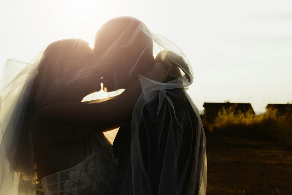 An intimate elopement setting at a scenic park in Las Vegas, featuring lush greenery and a beautiful sunset. — destinati…