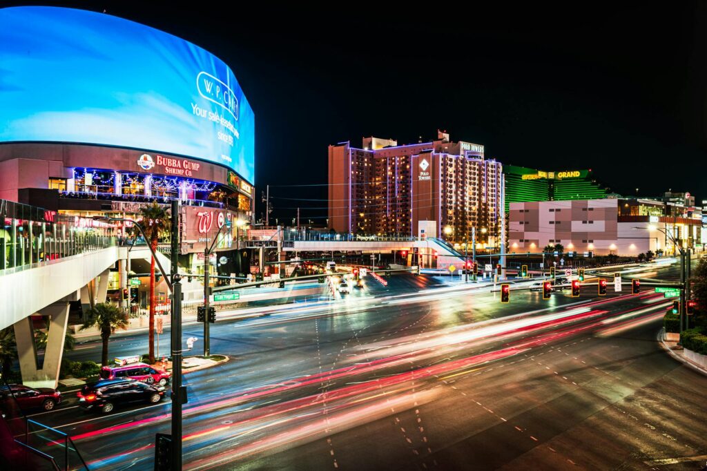 Couple exploring the Las Vegas Strip with guests enjoying activities. — destination wedding planning Las Vegas