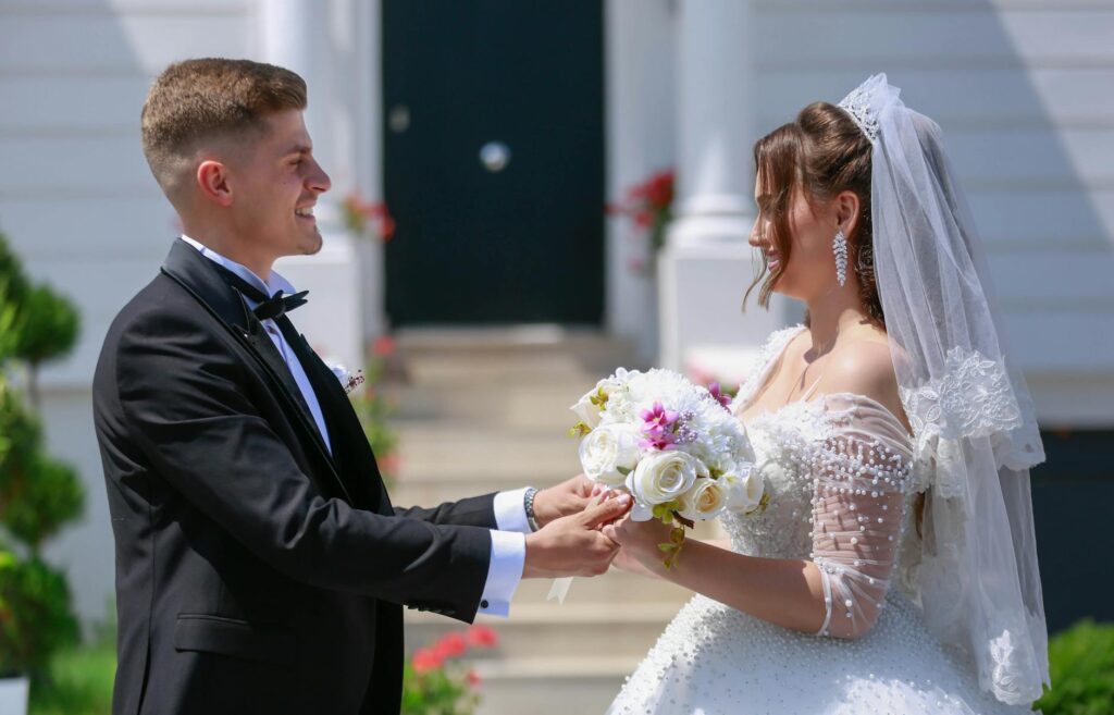 Happy couple exchanging vows in front of a Las Vegas wedding chapel. — Las Vegas wedding laws