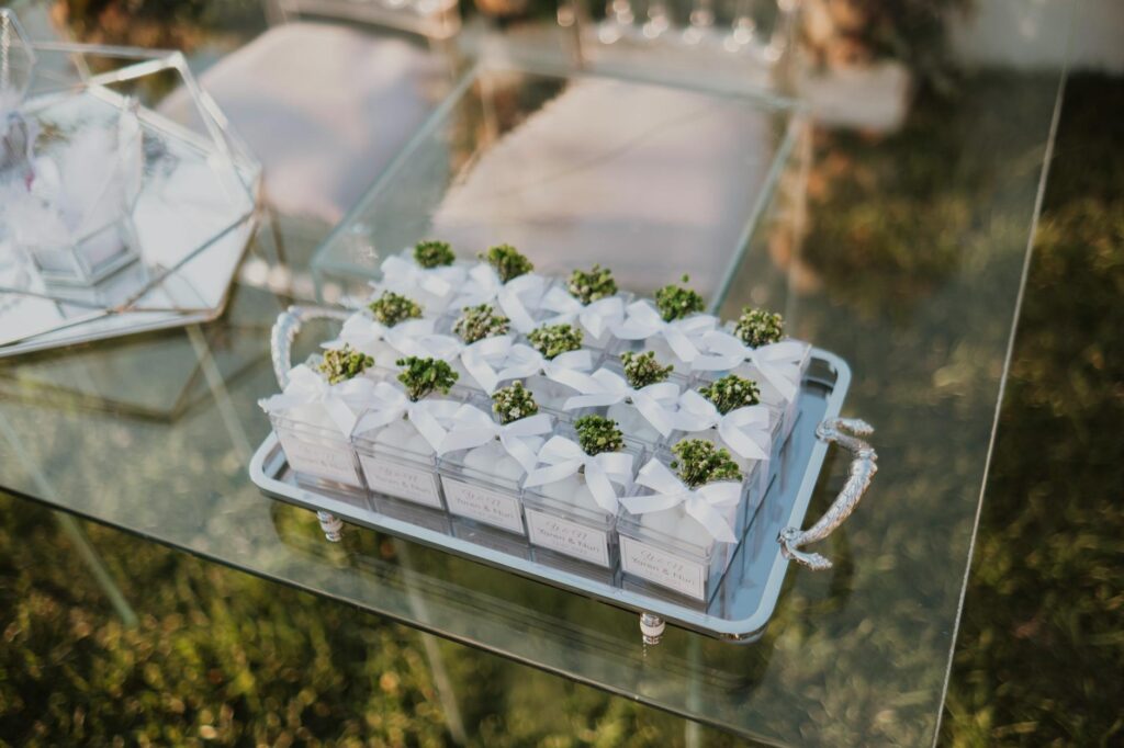 Personalized wedding favors displayed on a decorated table at a Las Vegas venue. — Las Vegas wedding trends