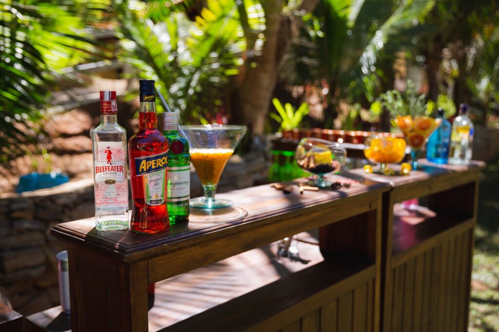 A DIY cocktail station with various ingredients and recipe cards for guests. — unique wedding activities Las Vegas