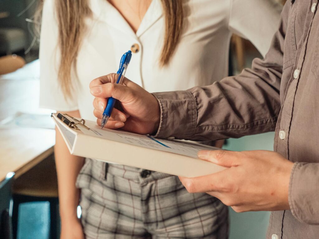 A close-up of a couple reviewing their wedding planning checklist. — Las Vegas wedding planning checklist