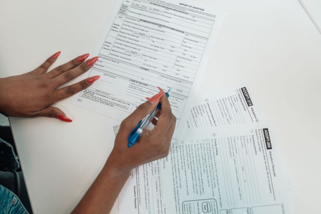 A close-up of a wedding license application being filled out, representing legal steps in elopement. — Las Vegas elopeme…