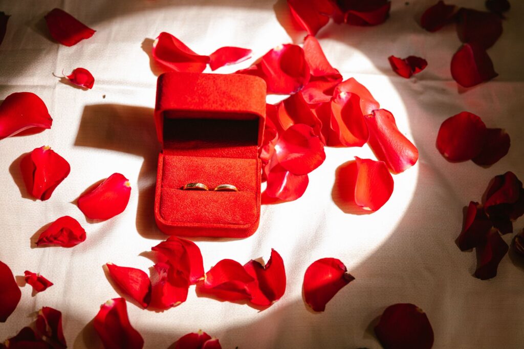 A close-up of wedding rings on a colorful Las Vegas-themed table setting, emphasizing the details that make each wedding u…