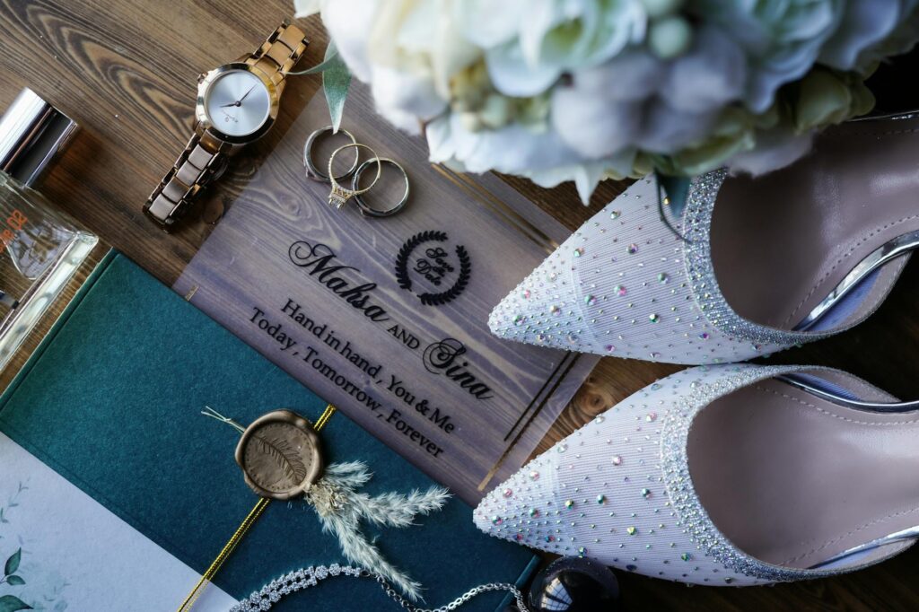 A close-up of wedding rings on a table adorned with Las Vegas-themed decorations. — destination wedding planning Las Vegas