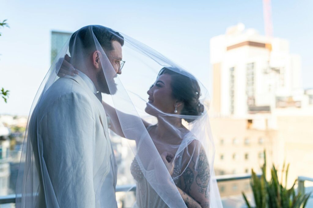 A couple celebrating their wedding day at a popular Las Vegas landmark, showcasing the city's unique charm. — best time …