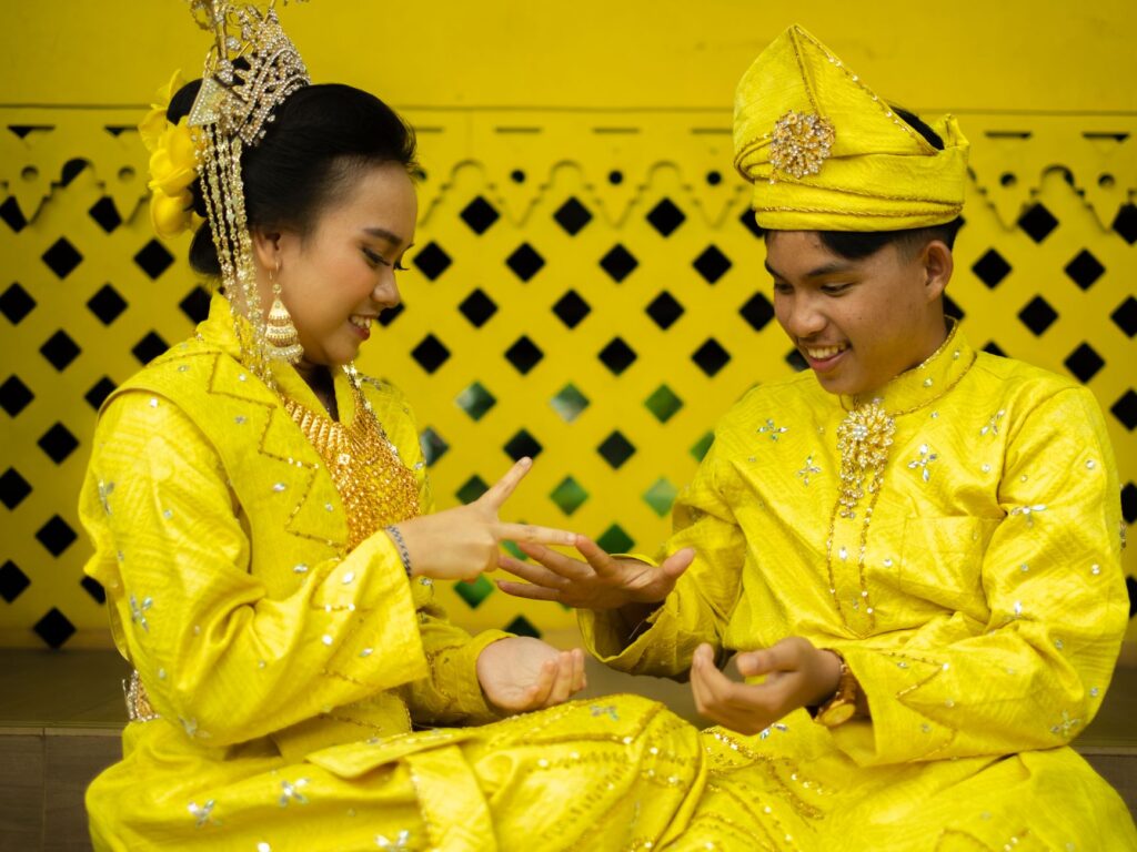 A couple dressed in Elvis costumes during a Las Vegas wedding ceremony. — Las Vegas wedding traditions