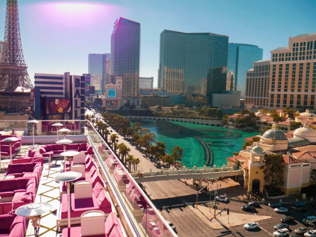 A couple exchanging vows with Las Vegas Strip in the backdrop. — best time to marry in Las Vegas