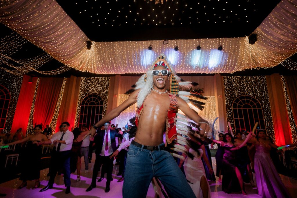 A fun party scene from a themed wedding LV featuring unique costumes and vibrant colors. — Vegas wedding theme ideas