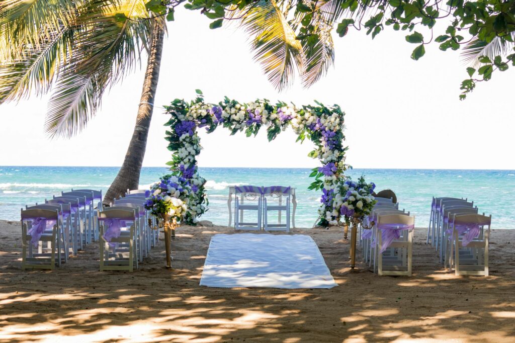 A gorgeous summer beach ceremony with a stunning sunset backdrop. — Las Vegas wedding trends 2026