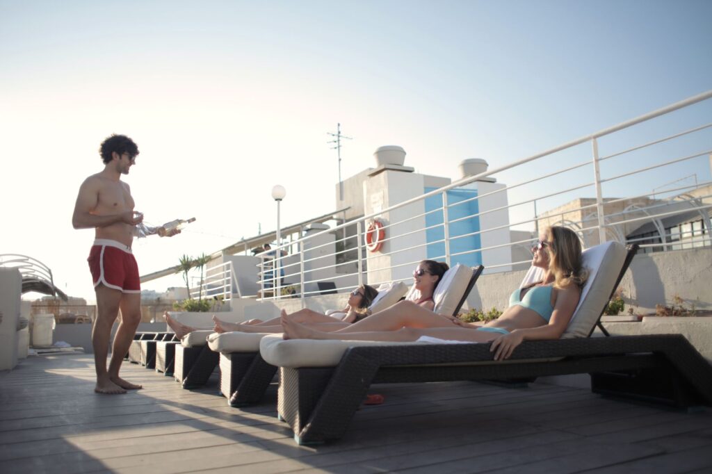 A group of friends enjoying a pool party at a luxury hotel in Las Vegas. — las vegas bachelor party guide