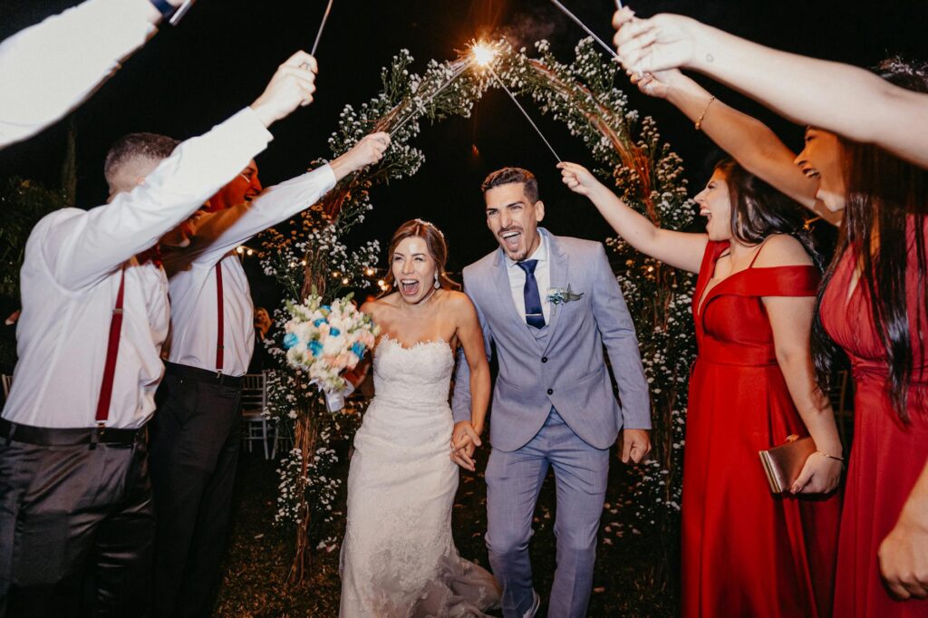 A happy couple celebrating with friends and family at a Las Vegas wedding. — Las Vegas wedding packages