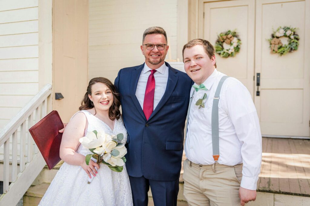 A happy couple posing with their officiant after a successful elopement ceremony. — Las Vegas elopement
