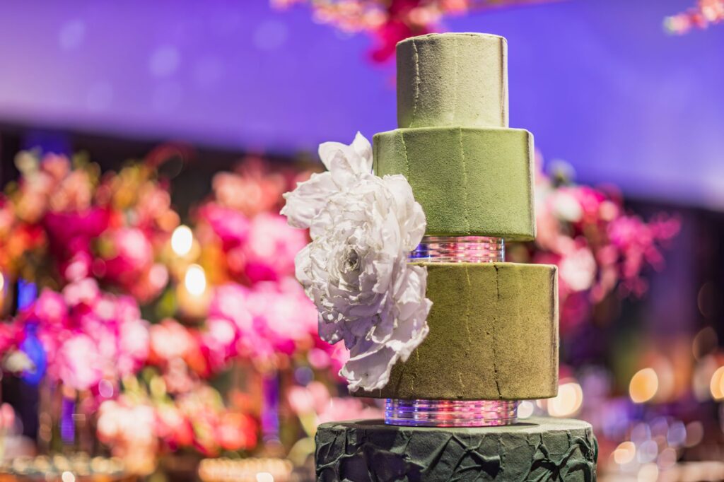 A lavish wedding cake designed for a luxury wedding, featuring intricate details and elegant decorations. — luxury las v…
