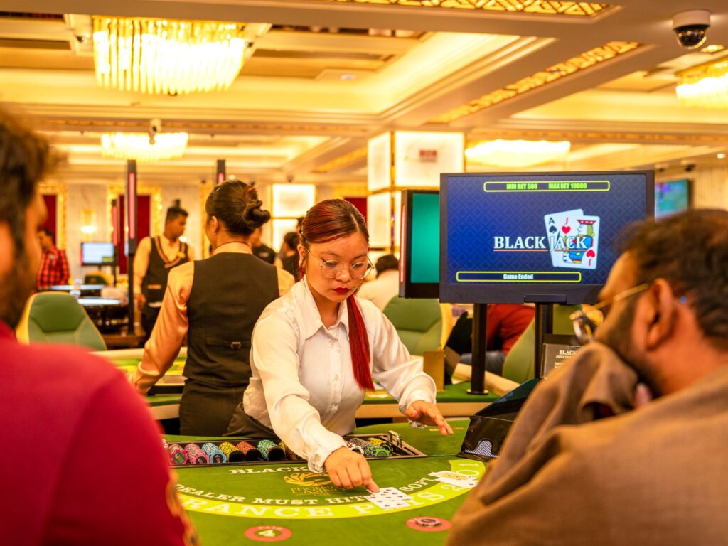 A lively casino-themed wedding reception with guests playing card games and enjoying casino decor. — Las Vegas wedding t…