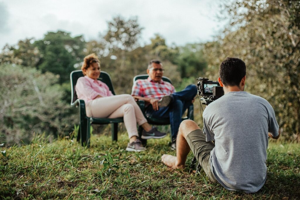 A photographer interviewing a couple in a picturesque Las Vegas location. — las vegas wedding photographer