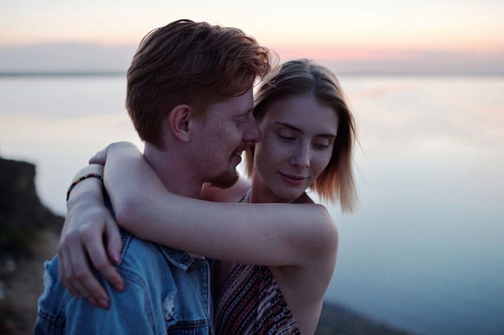 A romantic beach-like setting at Lake Mead, with a couple enjoying a serene moment by the water's edge. — las vegas wedd…
