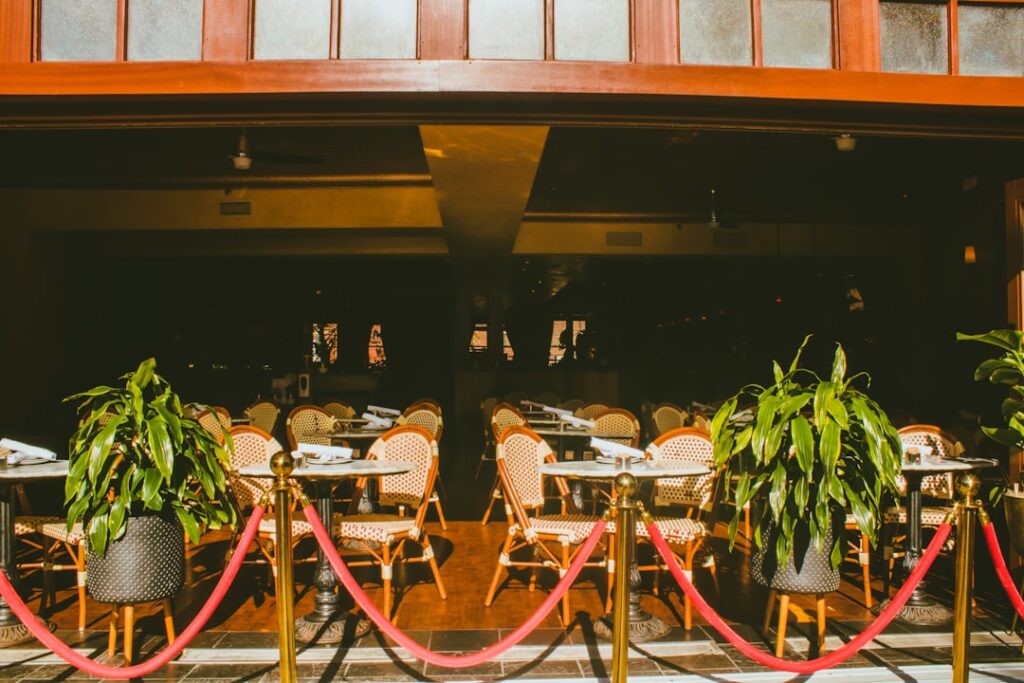 A stunning setup of a vintage Hollywood themed wedding with red carpet and elegant decor. — Las Vegas wedding themes