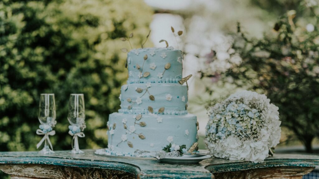 A stunning wedding cake decorated with Las Vegas-inspired designs, ready for the reception. — Las Vegas destination wedd…