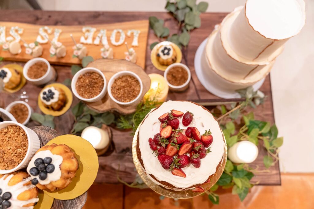 An array of wedding cakes from top Las Vegas bakers displayed at a wedding expo. — best wedding vendors Las Vegas