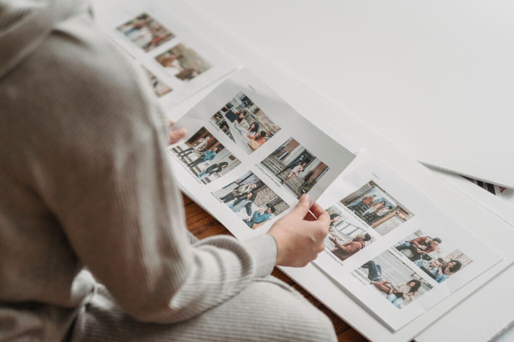 An image of a happy couple reviewing their wedding album with a photographer, emphasizing quality and satisfaction. — La…