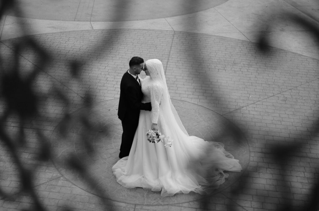 An intimate moment between a couple being photographed by a Las Vegas wedding photographer.