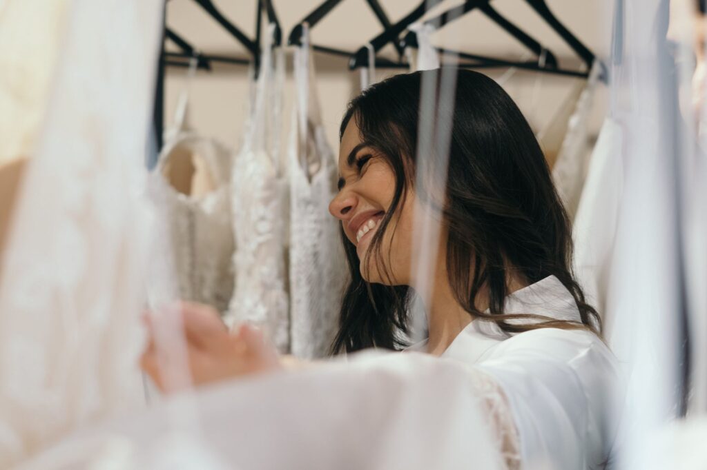 Brides trying on affordable wedding dresses at a boutique. — budget wedding ideas Las Vegas