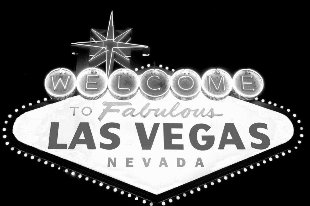 Couples enjoying a Las Vegas wedding reception with iconic Strip landmarks in the background, emphasizing the city's charm…